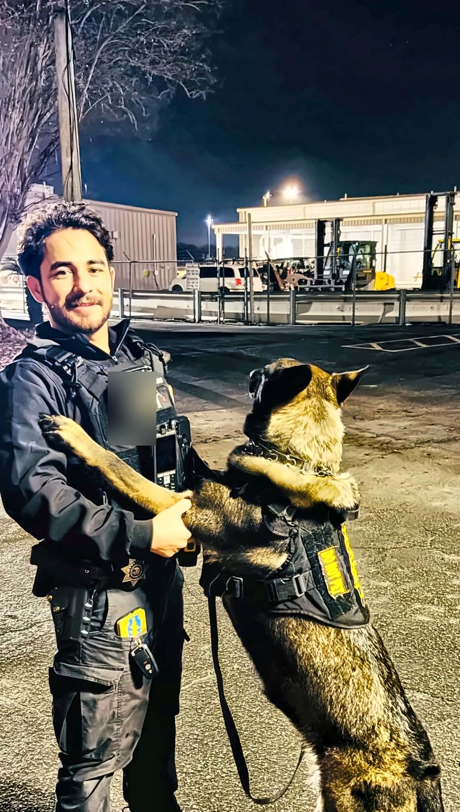 Black Force Security officer on night perimeter patrol
